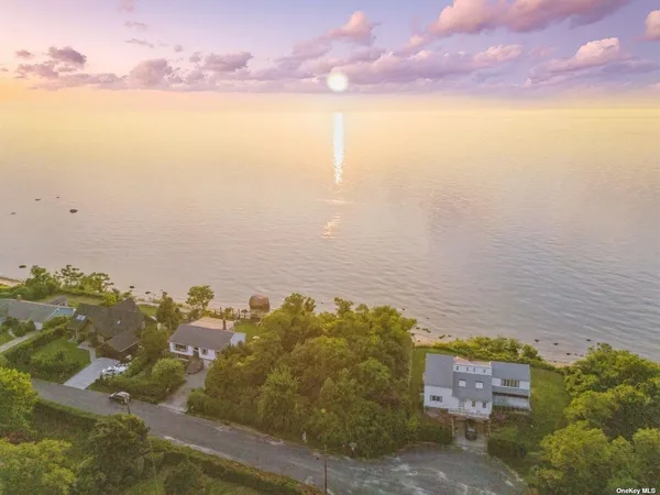 an aerial view of a house with yard