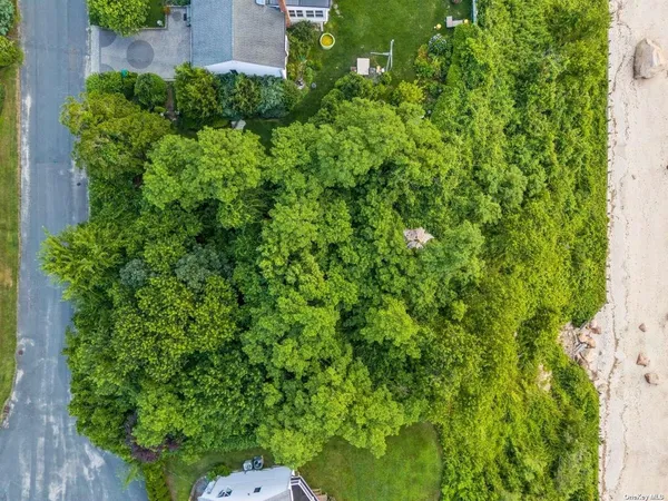 an aerial view of a house with a garden