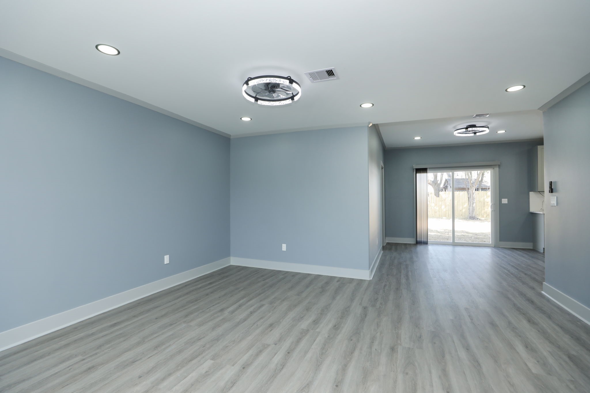 4047 Juliet Street Houston, TX 77087 - Photo 9 of 38 an empty room with wooden floor and windows