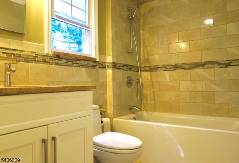 17 Wellington Road Livingston, NJ 07039 - Photo 15 of 20 a bathroom with a toilet sink and shower