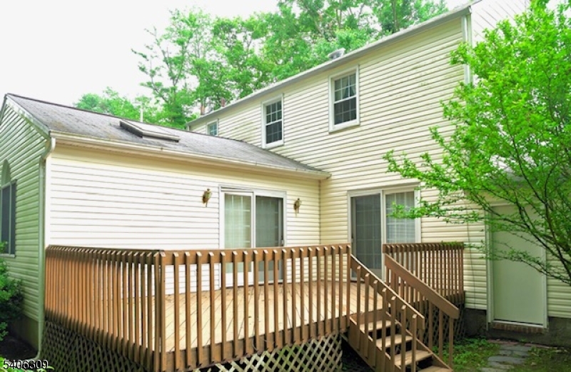 17 Wellington Road Livingston, NJ 07039 - Photo 20 of 20 a view of a house with a deck