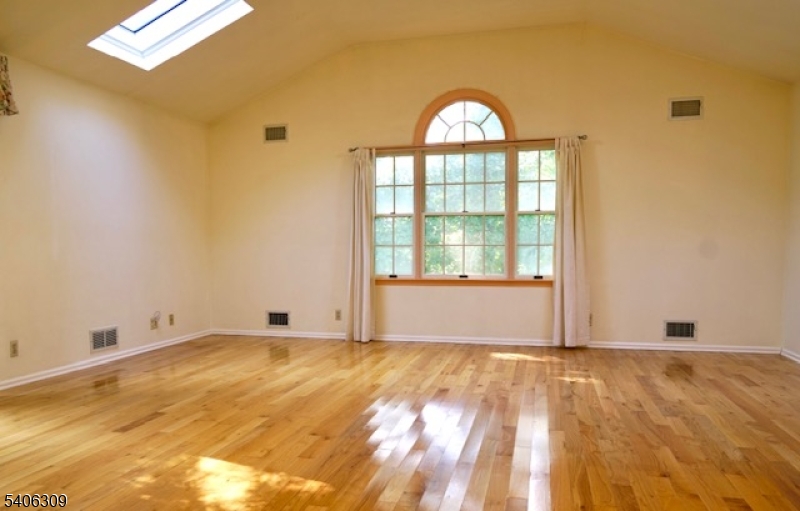 17 Wellington Road Livingston, NJ 07039 - Photo 3 of 20 a view of wooden floor and a window in a room