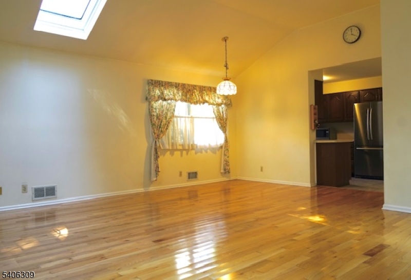 17 Wellington Road Livingston, NJ 07039 - Photo 4 of 20 a view of empty room with wooden floor