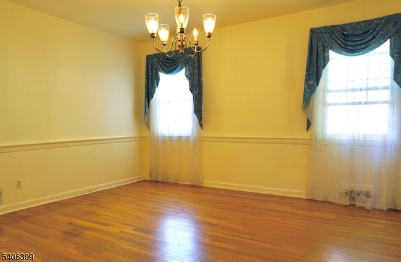 17 Wellington Road Livingston, NJ 07039 - Photo 10 of 20 an empty room with wooden floor