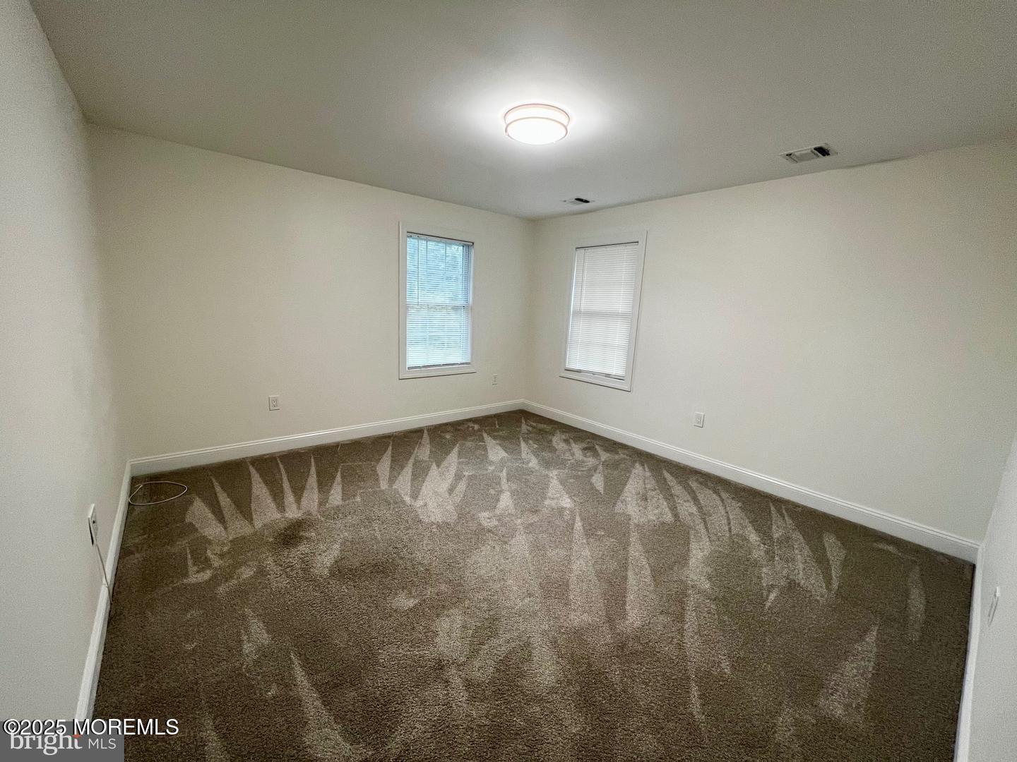 1253 Yardville Allentown Road, Unit 2 Allentown, NJ 08501 - Photo 5 of 12 an empty room with a window