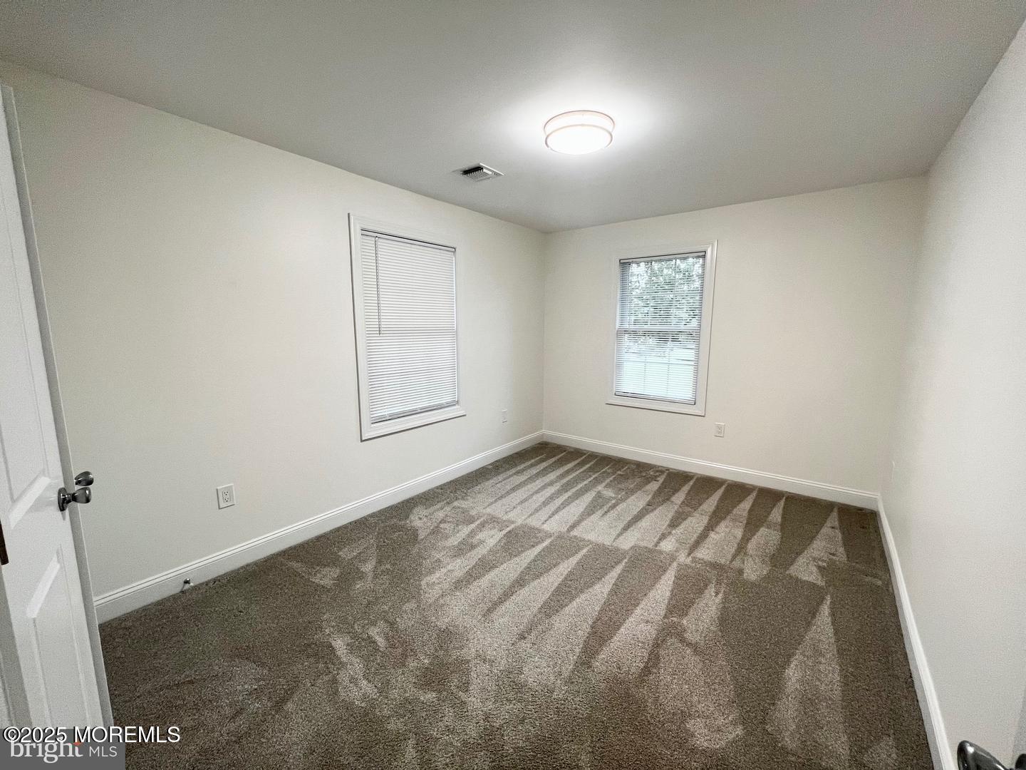 1253 Yardville Allentown Road, Unit 2 Allentown, NJ 08501 - Photo 8 of 12 an empty room with windows