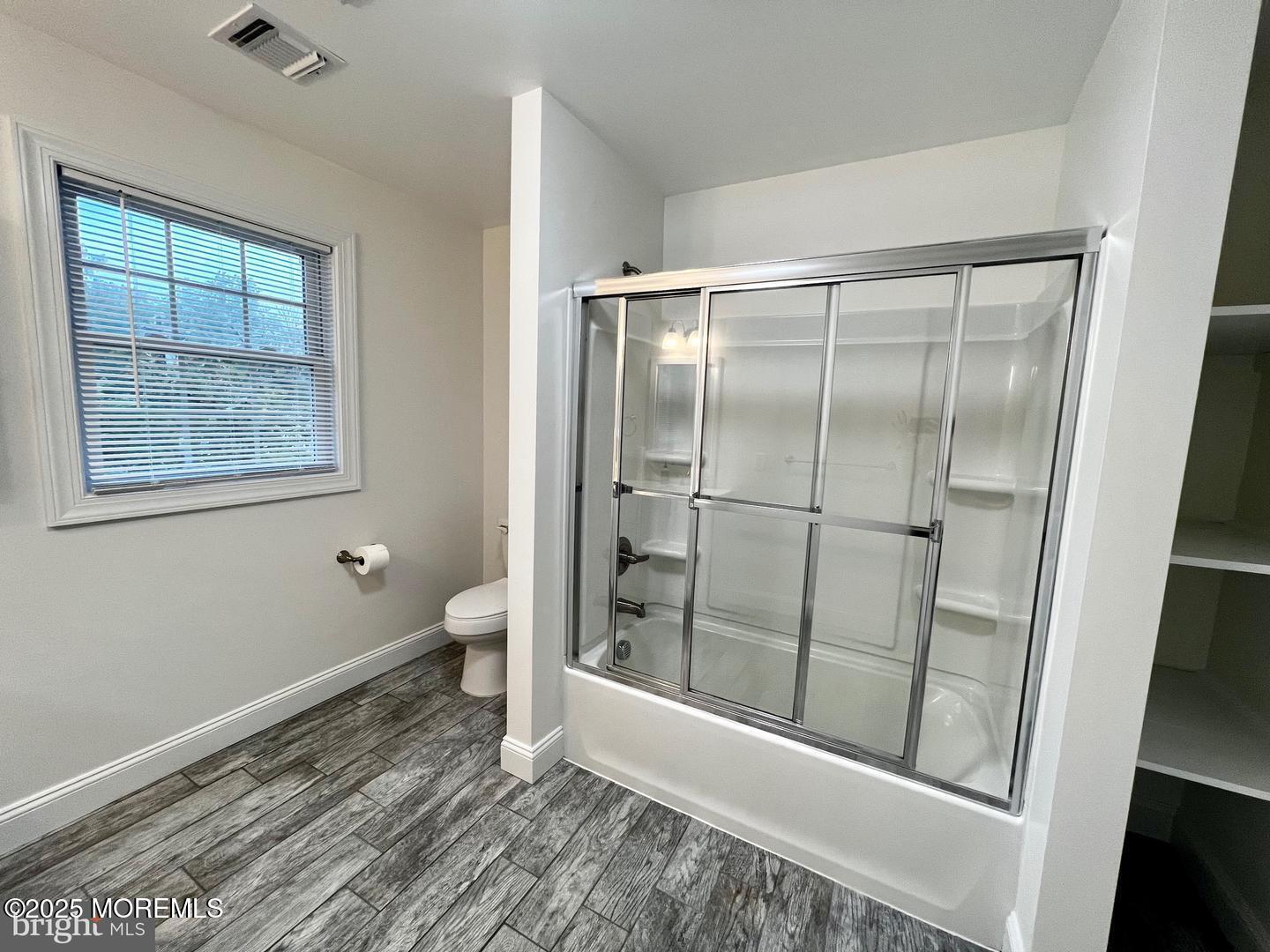 1253 Yardville Allentown Road, Unit 2 Allentown, NJ 08501 - Photo 9 of 12 a bathroom with a glass shower door and a toilet