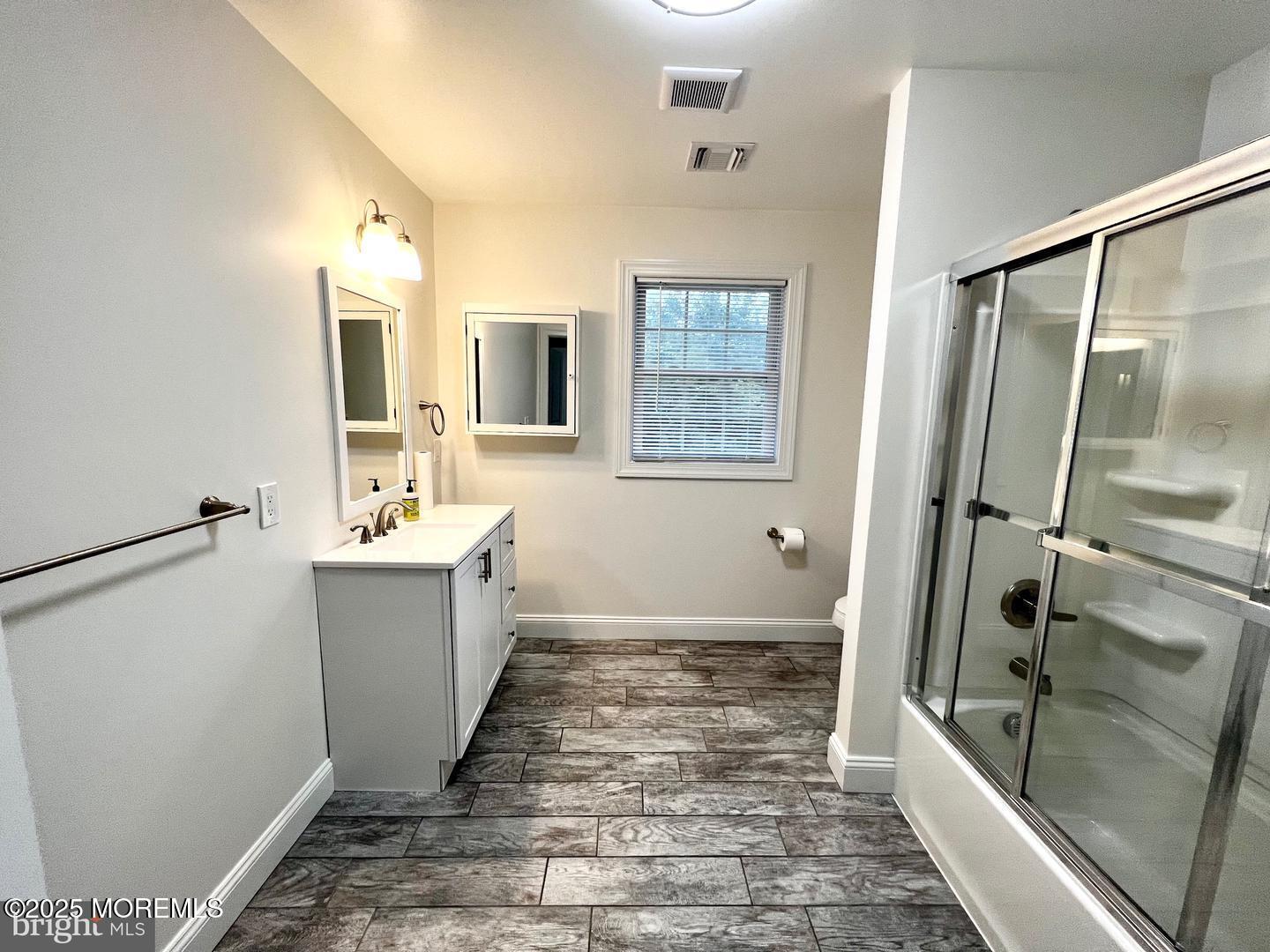 1253 Yardville Allentown Road, Unit 2 Allentown, NJ 08501 - Photo 10 of 12 a bathroom with a sink a mirror and a bathtub