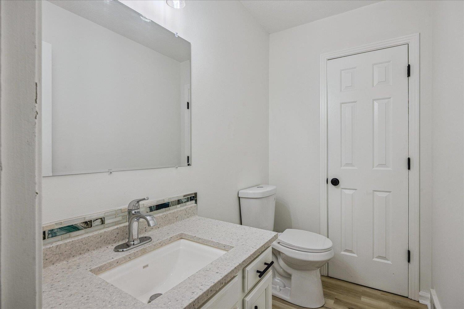 6137 Quince Road Memphis, TN 38119 - Photo 13 of 19 Bathroom with vanity and light wood-type flooring