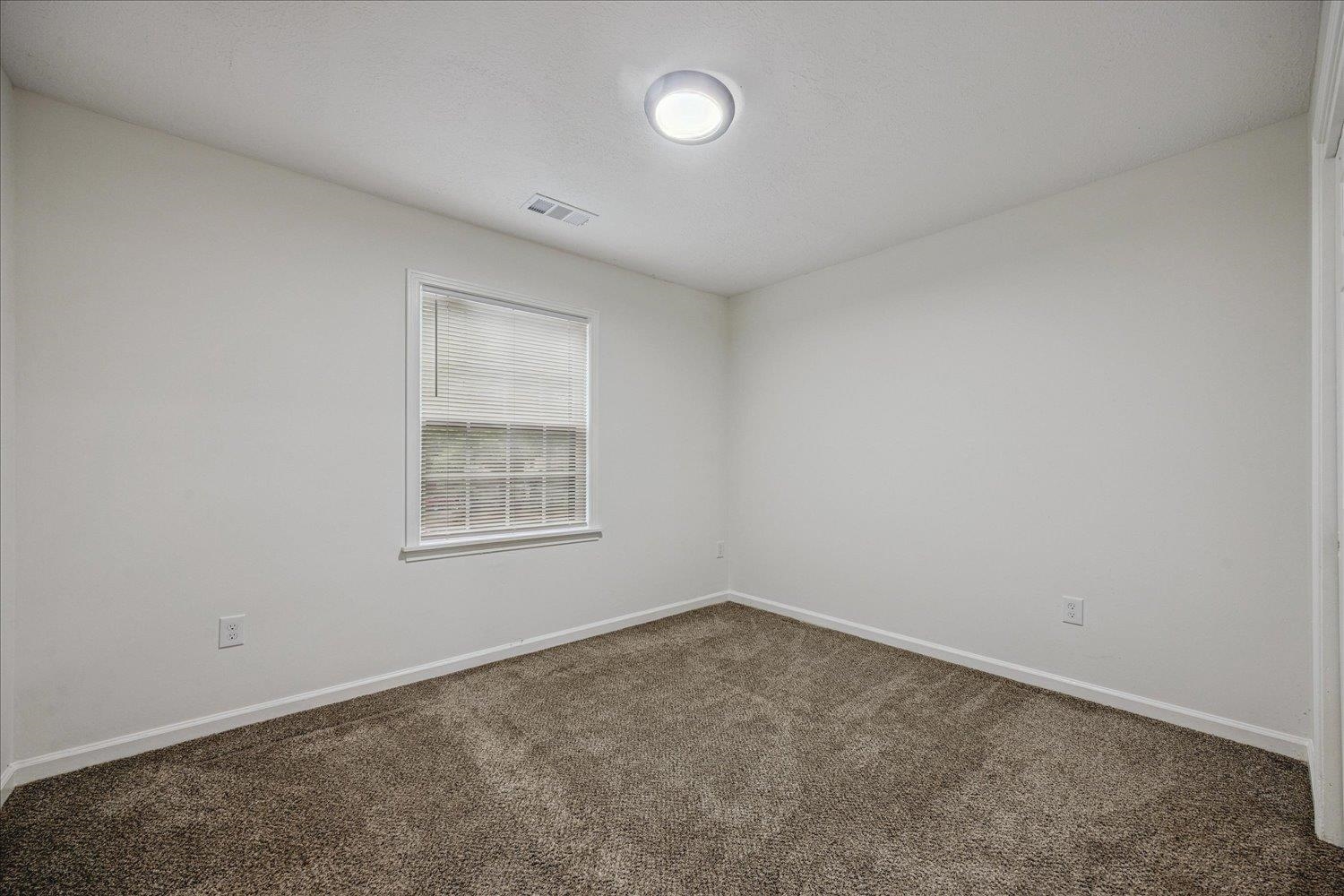 6137 Quince Road Memphis, TN 38119 - Photo 18 of 19 Empty room with baseboards and dark colored carpet