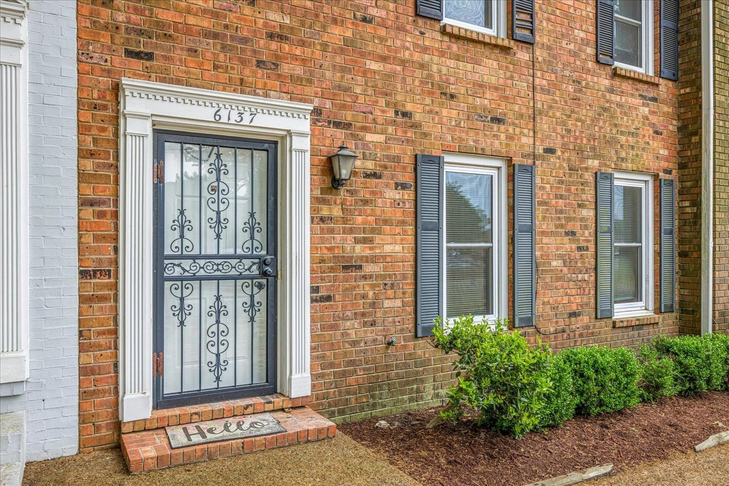 6137 Quince Road Memphis, TN 38119 - Photo 2 of 19 View of exterior entry with brick siding