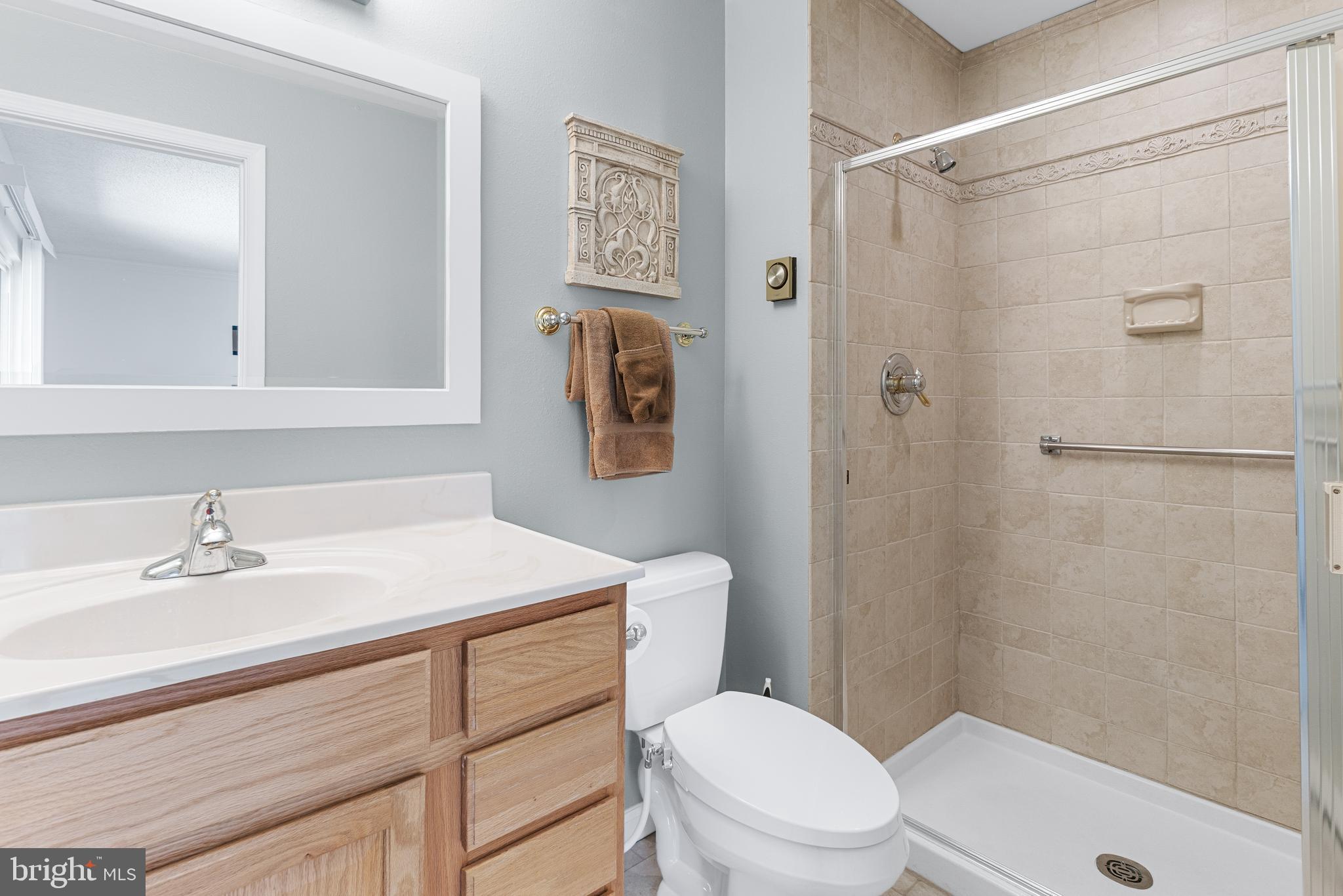 15400 Short Ridge Court, Unit 42A Silver Spring, MD 20906 - Photo 15 of 24 a bathroom with a sink a toilet and shower