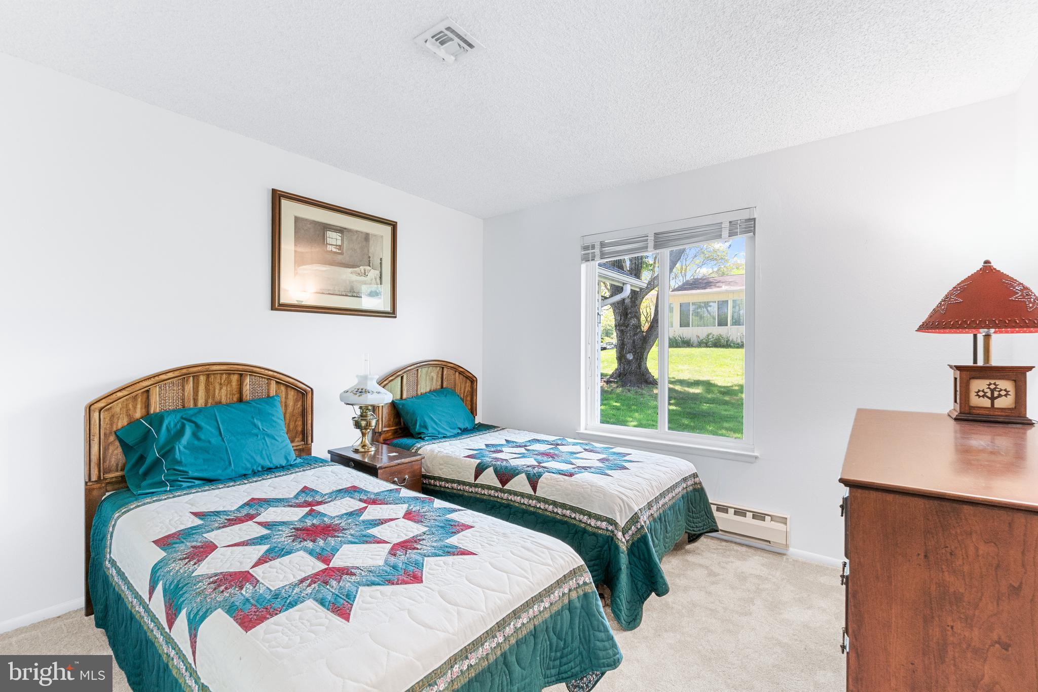 15400 Short Ridge Court, Unit 42A Silver Spring, MD 20906 - Photo 19 of 24 a bedroom with two beds and a window
