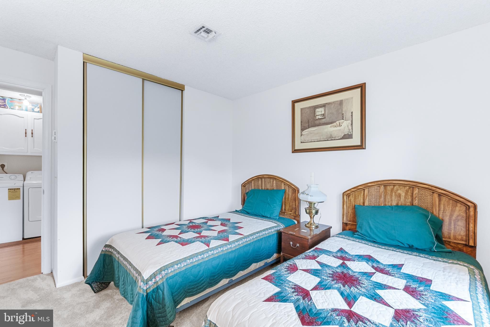 15400 Short Ridge Court, Unit 42A Silver Spring, MD 20906 - Photo 20 of 24 a bedroom with two beds and a table