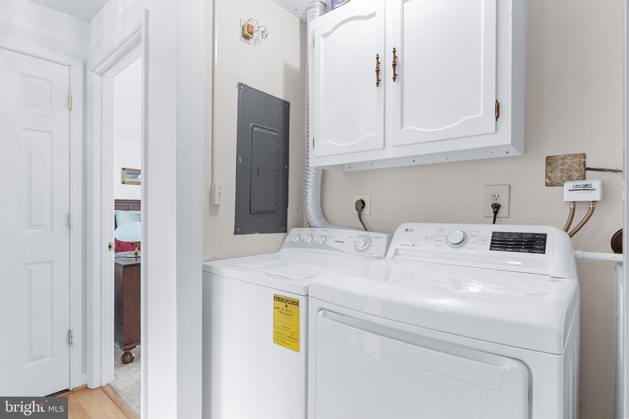 15400 Short Ridge Court, Unit 42A Silver Spring, MD 20906 - Photo 21 of 24 a utility room with dryer and washer