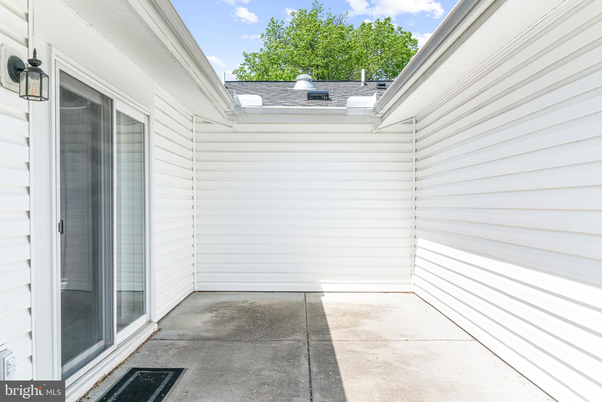 15400 Short Ridge Court, Unit 42A Silver Spring, MD 20906 - Photo 22 of 24 a view of house with backyard