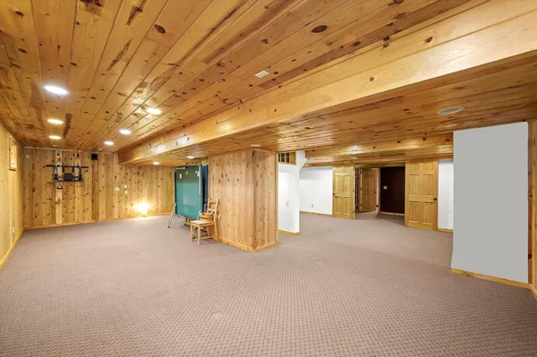 a view of a hall with white walls