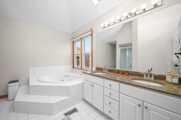 a bathroom with a sink a toilet and bathtub