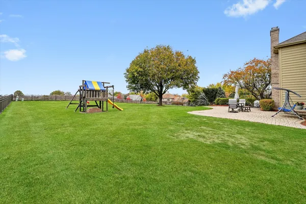 a view of a park with large trees