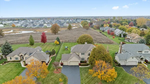an aerial view of multiple house with yard