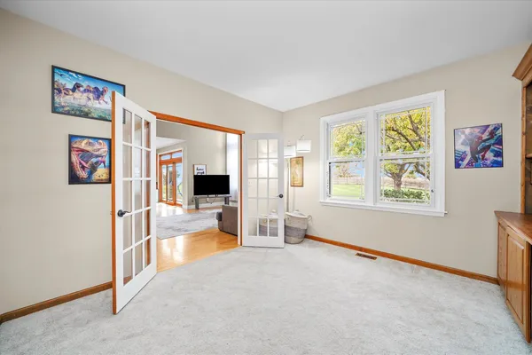 a view of livingroom with furniture window and workspace