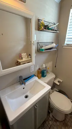 a bathroom with a sink and a mirror