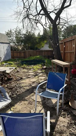 a view of a backyard with sitting area