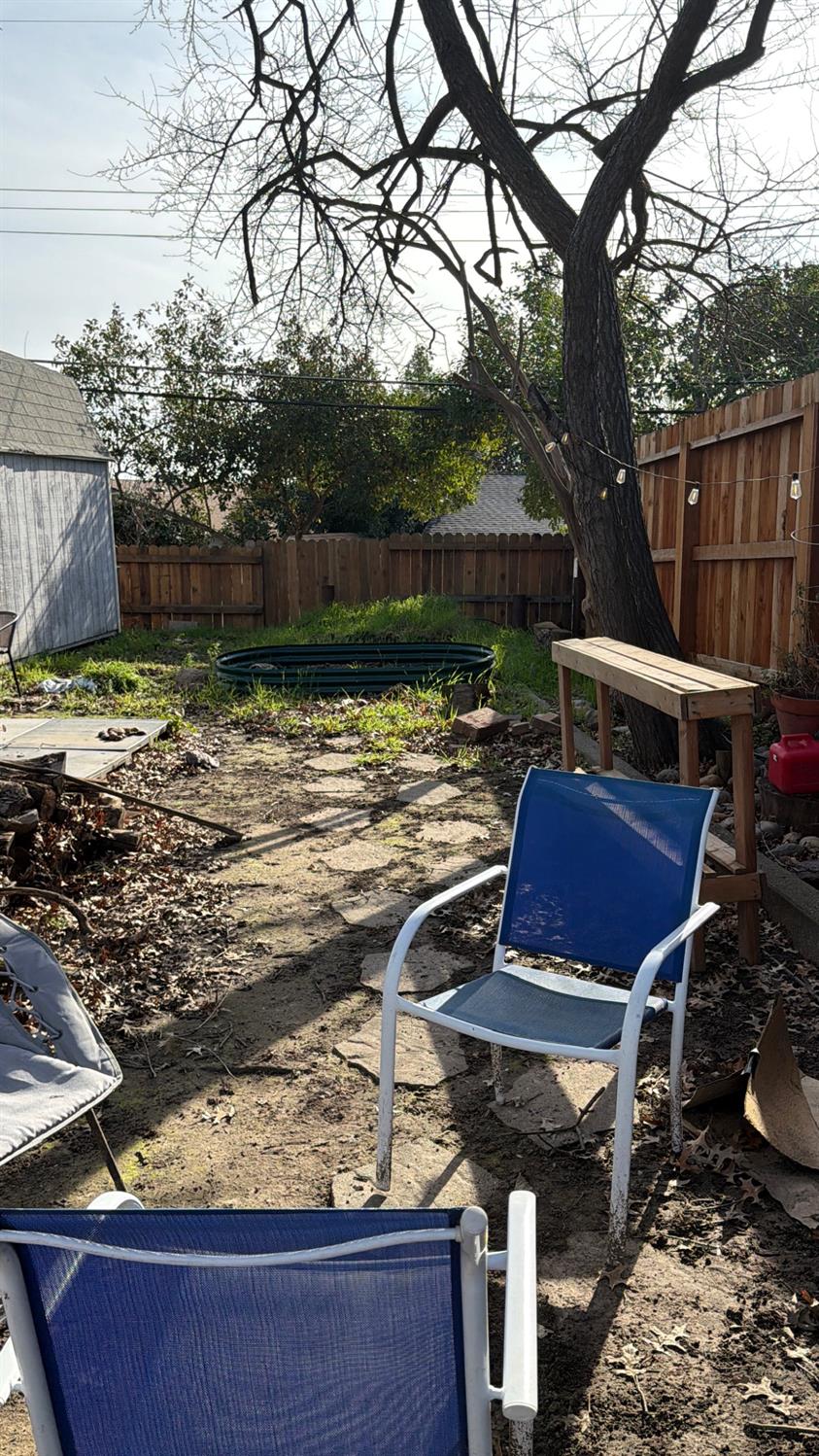 6140 Marwick Way Carmichael, CA 95608 - Photo 16 of 17 a view of a backyard with sitting area