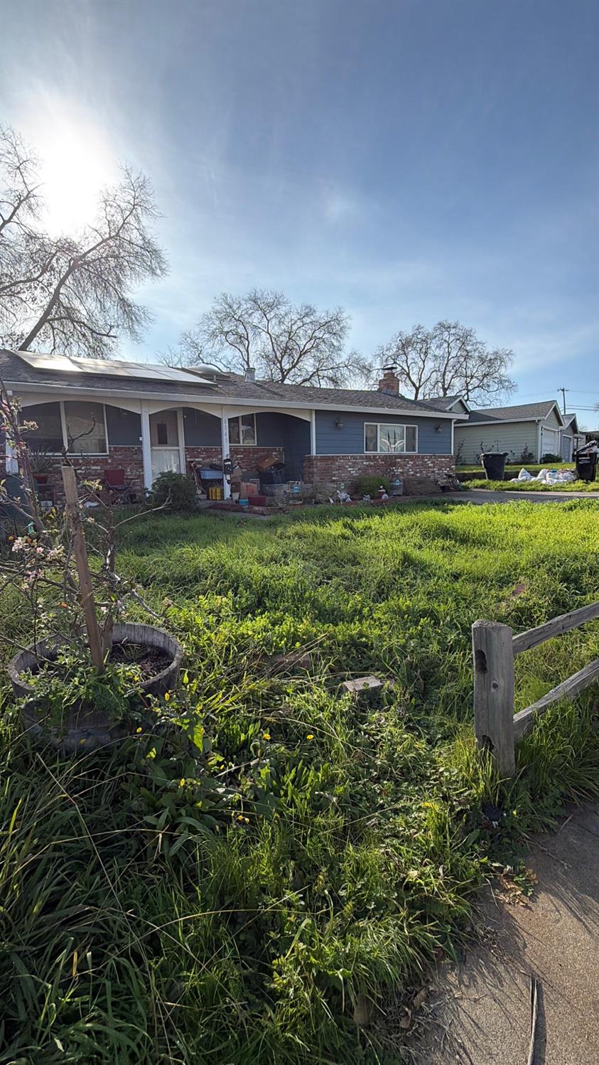6140 Marwick Way Carmichael, CA 95608 - Photo 2 of 17 a view of a house with a yard and potted plants