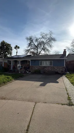 a view of house with a yard