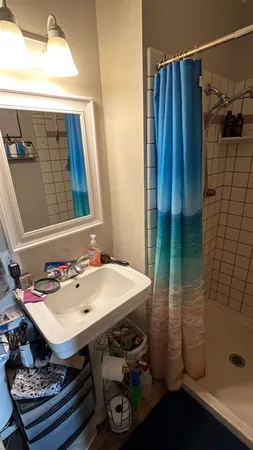 a bathroom with a sink and a mirror