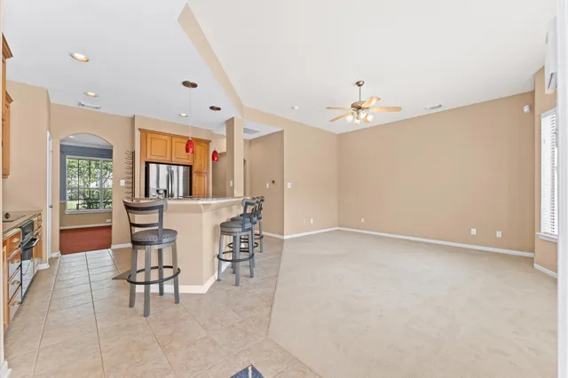 a view of a livingroom with furniture and a chandelier