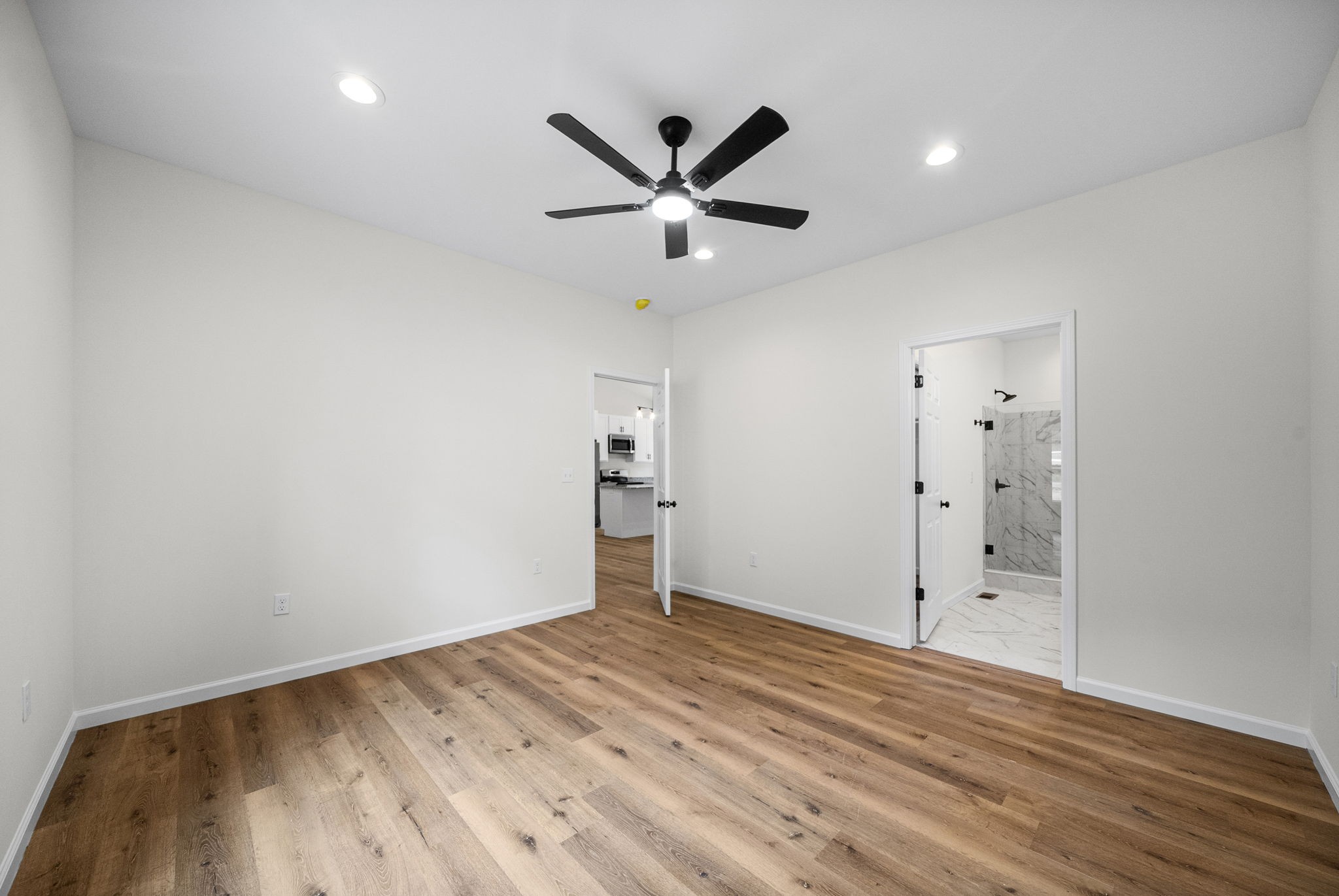 690 Brazzle Road Waverly, TN 37185 - Photo 18 of 35 wooden floor in an empty room with a window