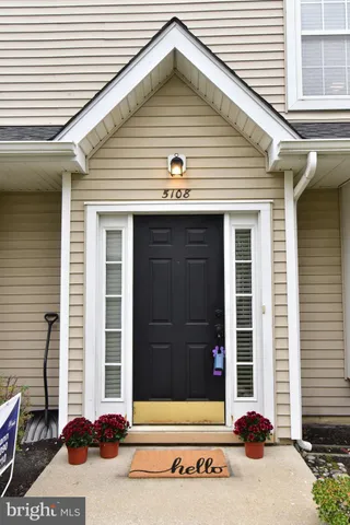 a view of a house with a door and a window