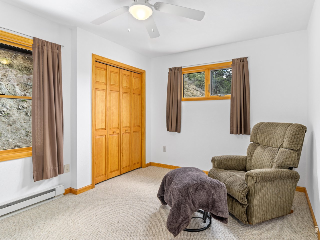 1002 Streamside Drive Drake, CO 80515 - Photo 10 of 37 a bedroom with furniture and a window
