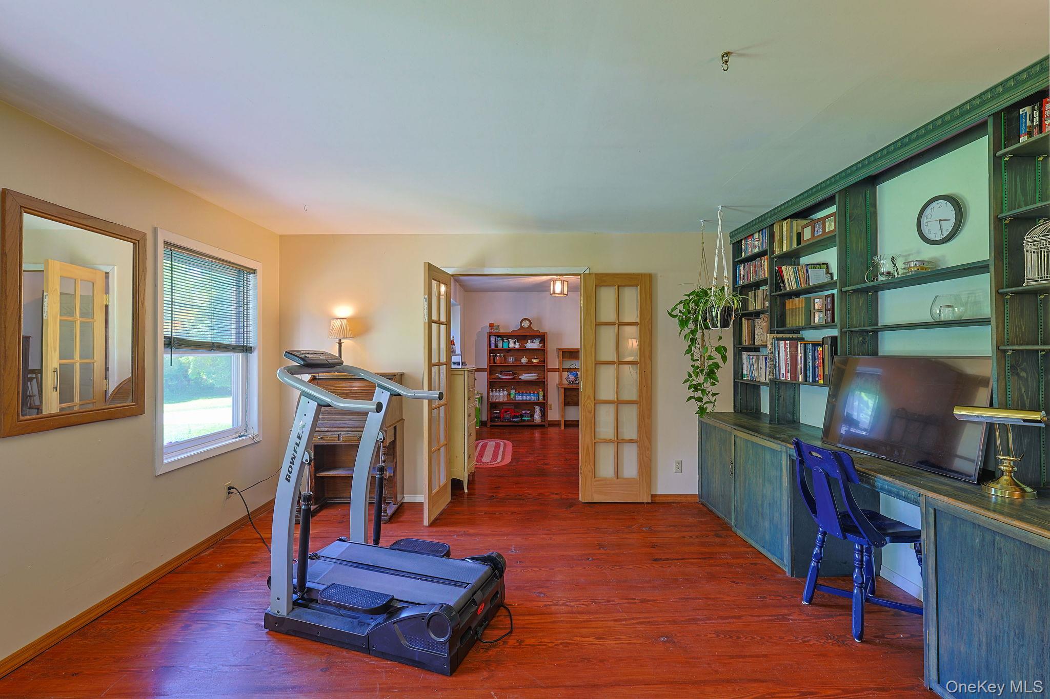 646 County Rte 93 Slate Hill, NY 10973 - Photo 11 of 21 Custom built-in shelving with integrated cabinetry and a dedicated work space.