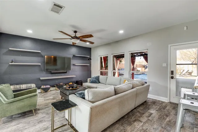a living room with furniture and a window