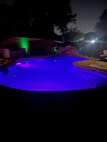 a view of a yard with swimming pool