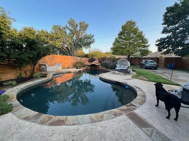 a view of a swimming pool with a patio