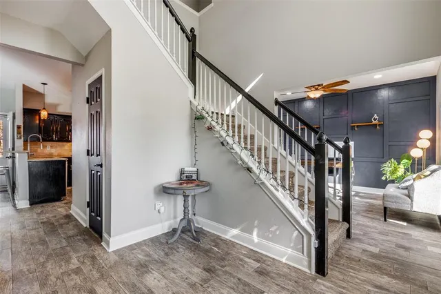 a view of entryway and hall with wooden floor