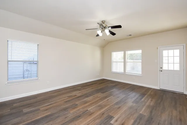 a bedroom with a bed a couch and a window