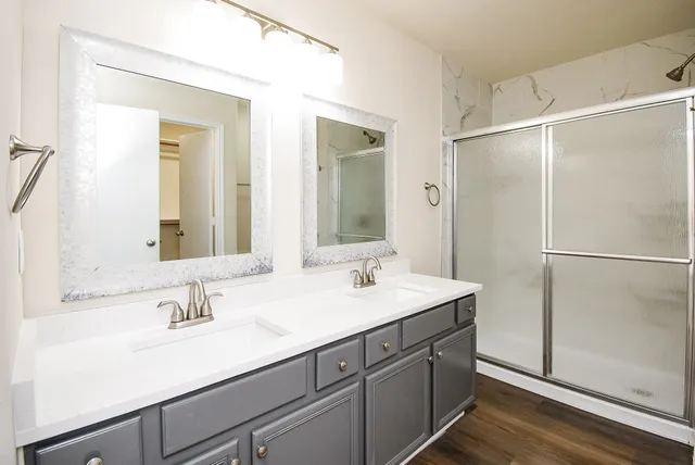 a view of a room with stairs and a floor to ceiling window