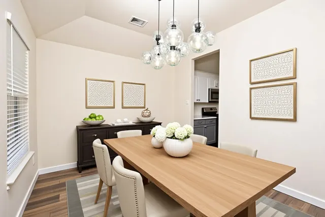 a view of a kitchen with a dishwasher cabinets and wooden floor