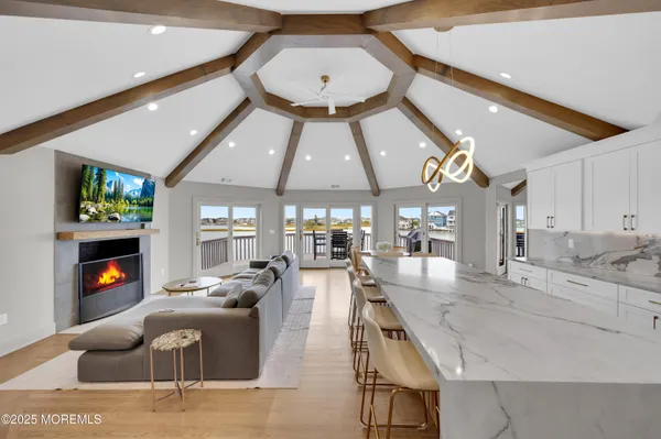 a large white kitchen with a large window