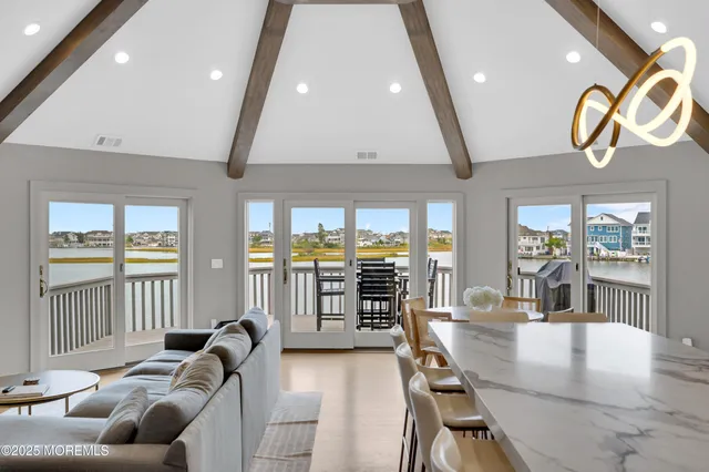 a view of balcony with wooden floor and fence