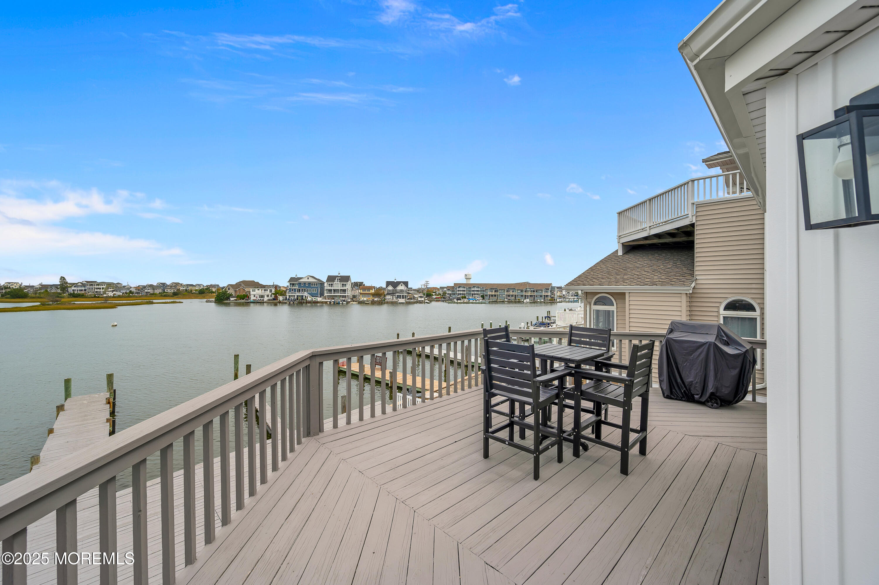 28 Harborside Drive East Seaside Heights, NJ 08751 - Photo 14 of 34 a terrace with outdoor seating and city view