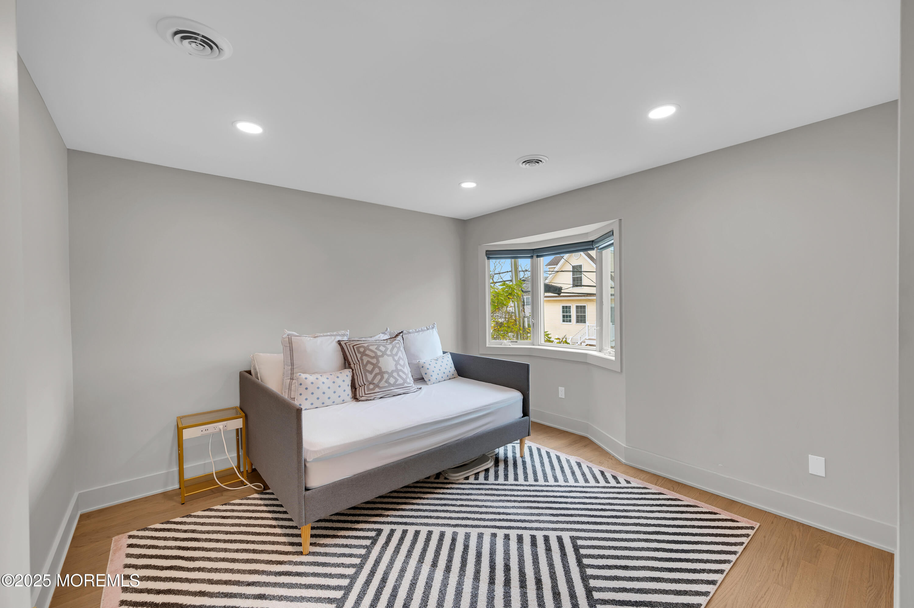 28 Harborside Drive East Seaside Heights, NJ 08751 - Photo 16 of 34 a living room with a couch and a window