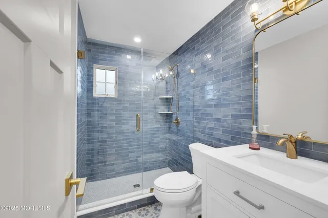 a spacious bedroom with a bed and a large window