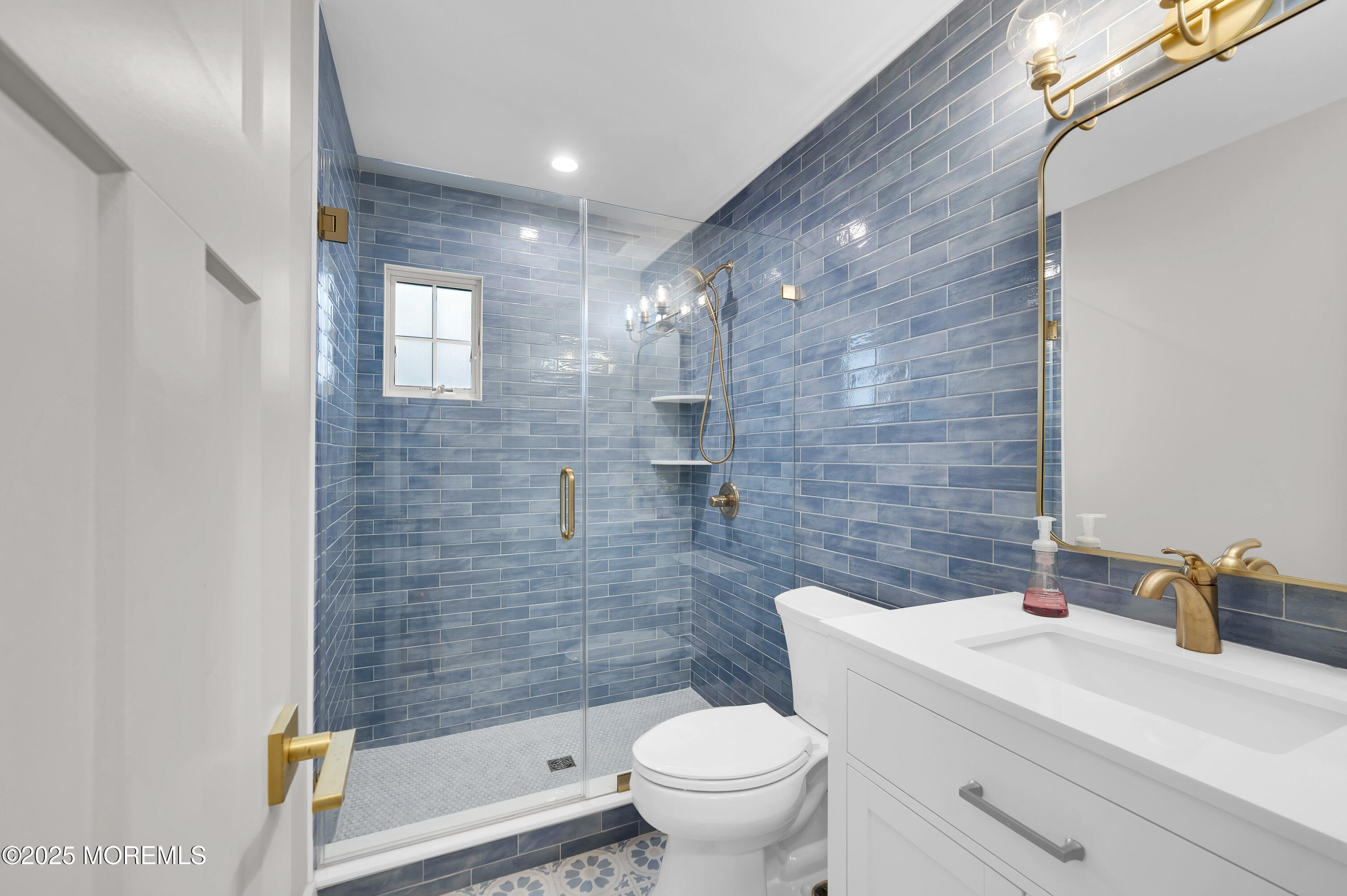 28 Harborside Drive East Seaside Heights, NJ 08751 - Photo 19 of 34 a bathroom with a sink a toilet and shower