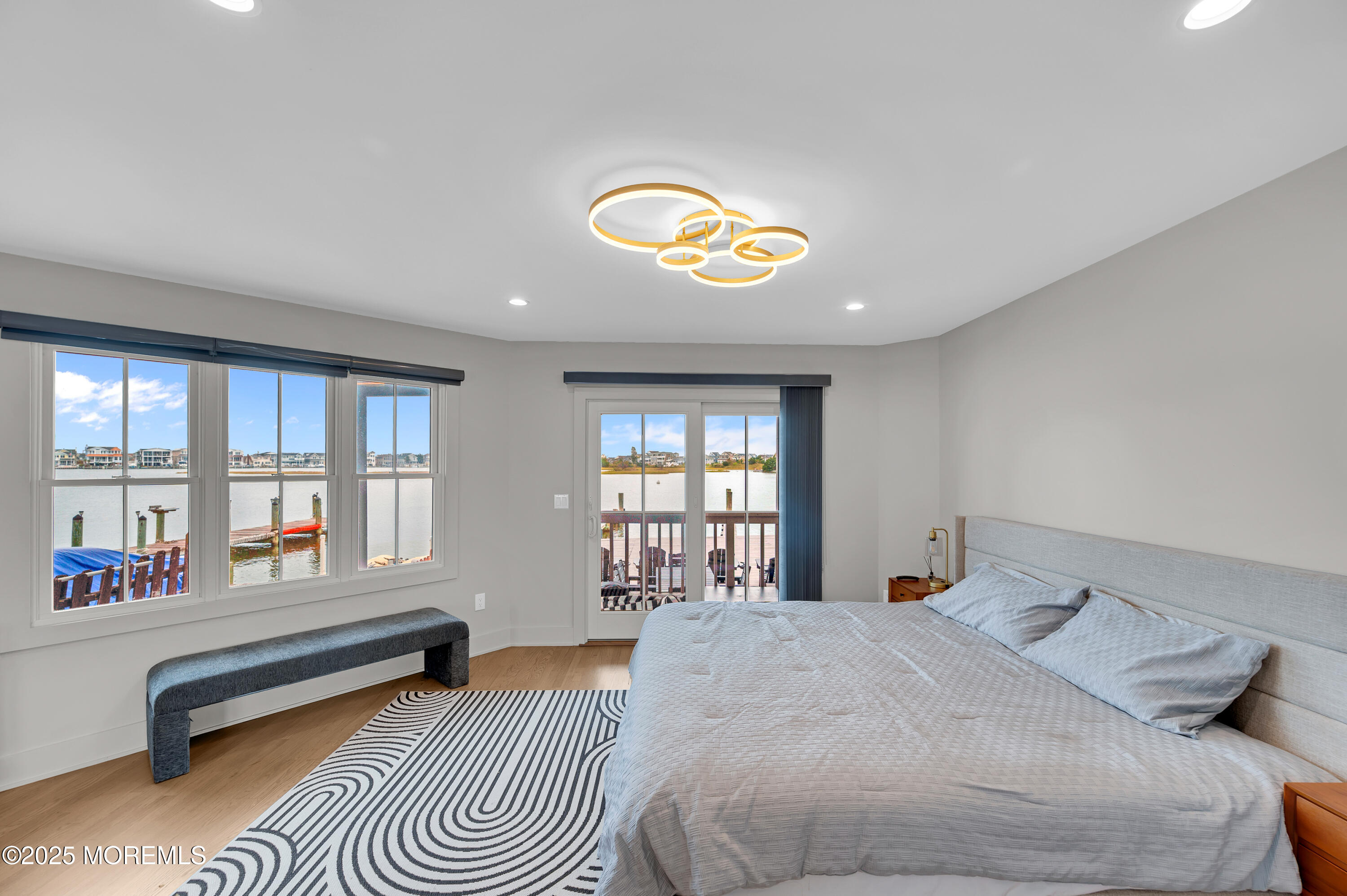 28 Harborside Drive East Seaside Heights, NJ 08751 - Photo 20 of 34 a spacious bedroom with a bed and a large window